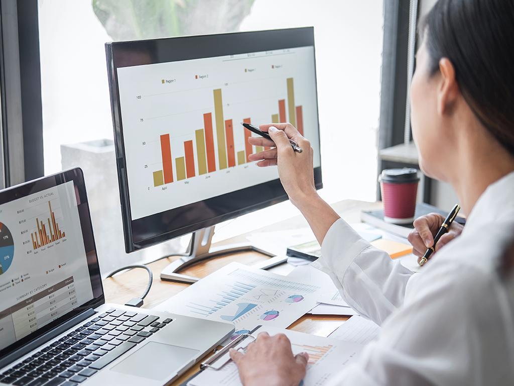 A fixed ops professional analyzing data to enhance the performance of the dealership service center.